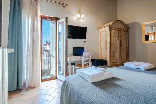 Ένα ή περισσότερα κρεβάτια σε δωμάτιο στο Hotel Noce