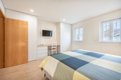 Postel nebo postele na pokoji v ubytování A Casa da Sara