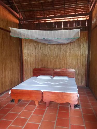 Ένα ή περισσότερα κρεβάτια σε δωμάτιο στο Ba Linh Homestay