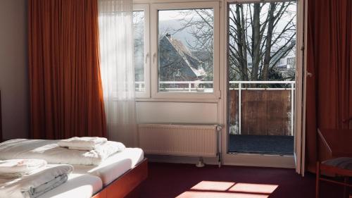 Postel nebo postele na pokoji v ubytování Gästehaus Tilly