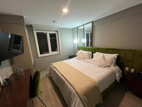 Postel nebo postele na pokoji v ubytování Olivar House Hotel