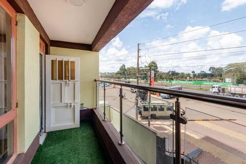 a balcony of a building with a view of a street at 2bedroom house along waiyaki way in Nairobi