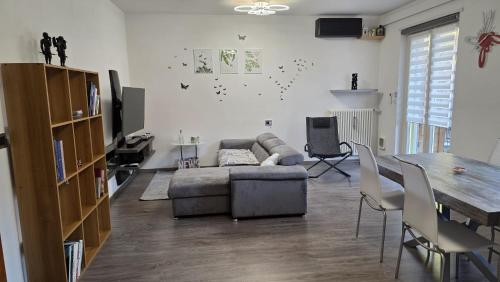 a living room with a couch and a table at GS Valtellina in Morbegno