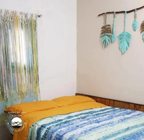 En eller flere senge i et værelse på Cabaña La Casona de los Paredones