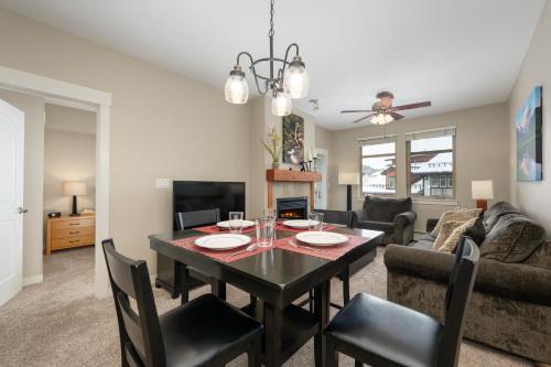 a dining room and living room with a table and chairs at Ski-In / Ski-Out 1 Bedroom Condo base of WP Resort in Winter Park