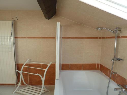 a shower with a glass door in a bathroom at Five-Bedroom Holiday Home in Somme-Leuze in Somme-Leuze