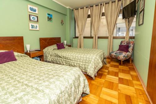 Giường trong phòng chung tại Departamento Freire