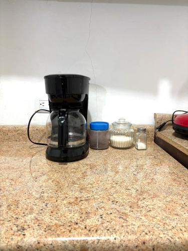 a coffee maker sitting on top of a counter at Cómodo departamento 2 cerca del centro de gobierno , CAS, Consulado , CRIT in Hermosillo