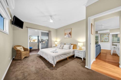 a bedroom with a bed and a living room at Cypress Sea Breeze in Woorim