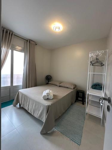 En eller flere senge i et værelse på Apartamento Centro Torres Jose Bonifacio