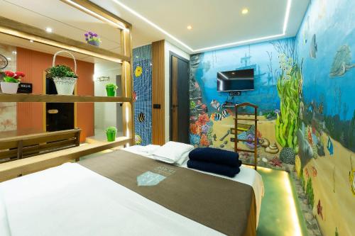 En eller flere senge i et værelse på Botanical House