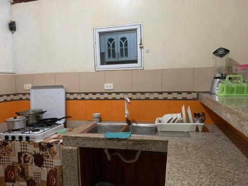 Η κουζίνα ή μικρή κουζίνα στο FELIZ ESTADIA en PUERTO LOPEZ