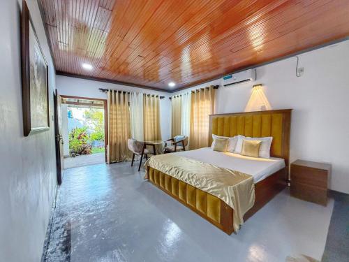 Ένα ή περισσότερα κρεβάτια σε δωμάτιο στο Ceylon Seascape Villa