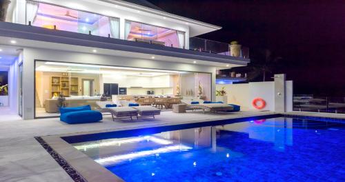 a house with a swimming pool and a living room at BLUE BUTTERFLY Luxury Pool Villa Koh Samui 5 Bedrooms in Koh Samui 