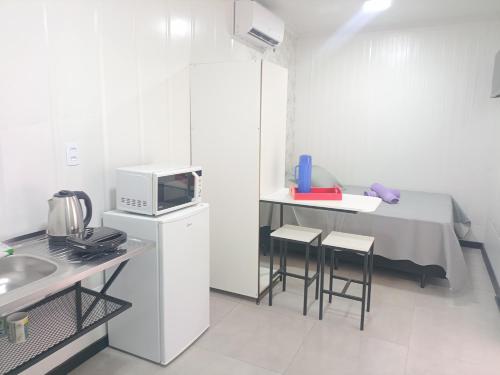 Køkken eller tekøkken på Studio Borboletas de luz