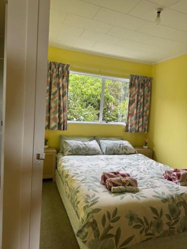 a bedroom with a large bed with a window at Buena Vista in Geraldine
