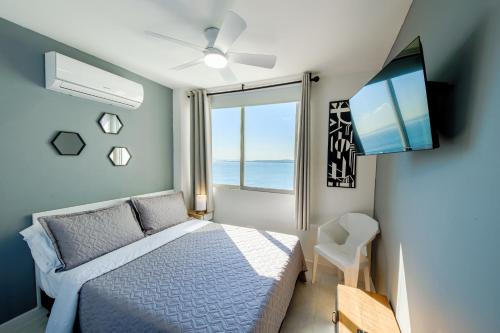 Ένα ή περισσότερα κρεβάτια σε δωμάτιο στο Alojamiento con Vista Y Salida al Mar