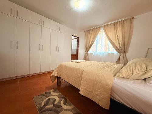 Ένα ή περισσότερα κρεβάτια σε δωμάτιο στο Departamento familiar