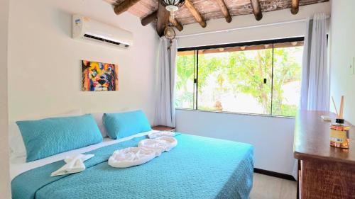 Ένα ή περισσότερα κρεβάτια σε δωμάτιο στο Pontal brava do sol