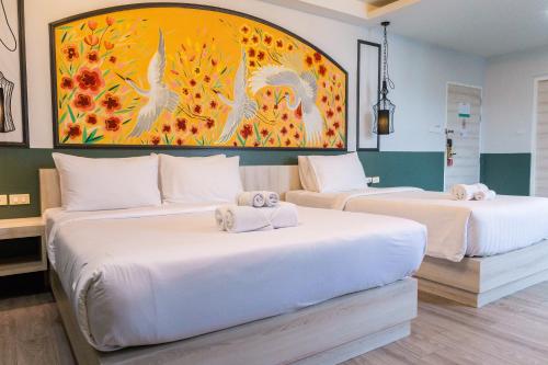 Ένα ή περισσότερα κρεβάτια σε δωμάτιο στο Peranakan House