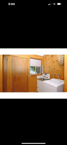 a kitchen with a white stove and a sink at Marlo Tide Retreat in Marlo