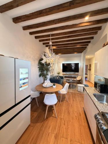 a kitchen and dining room with a wooden table and a dining room at A Dedicated Space To Unwind in Brooklyn