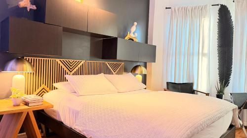 Ένα ή περισσότερα κρεβάτια σε δωμάτιο στο A Dedicated Space To Unwind