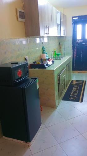 Kuchyň nebo kuchyňský kout v ubytování Cozy home