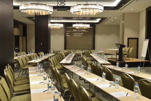 a conference room with long tables and chairs at Wyndham Grand Istanbul Europe in Istanbul