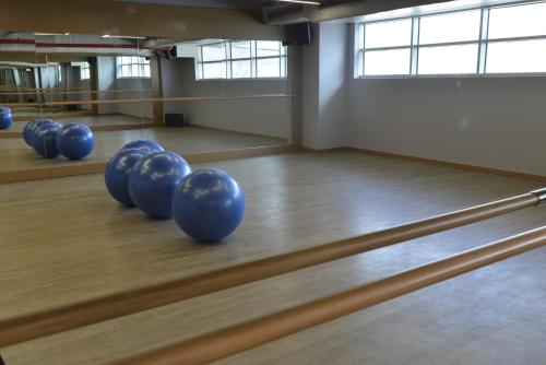a row of blue balls on a bowling alley at Wyndham Grand Istanbul Europe in Istanbul