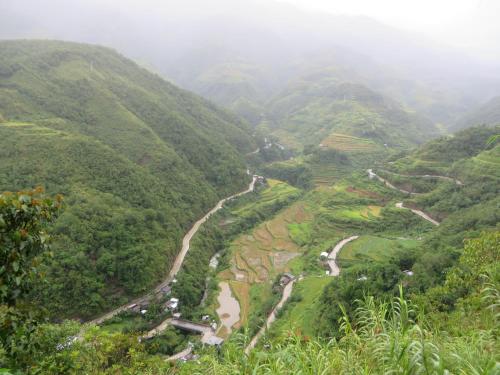 a view of a valley in the mountains at Native Village Inn in Banaue