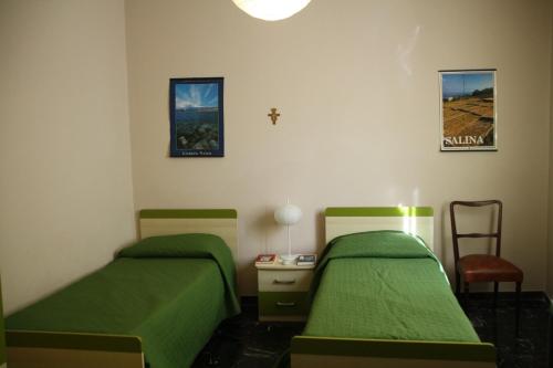Posteľ alebo postele v izbe v ubytovaní Casa Vacanza Don Matteo