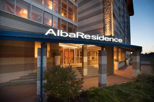 a building with a sign that reads alba residence at AlbaResidence Masera26 in Alba