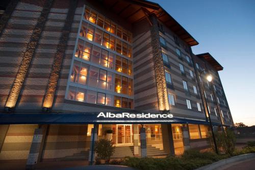 a building with an alabama residence sign on it at AlbaResidence Masera26 in Alba
