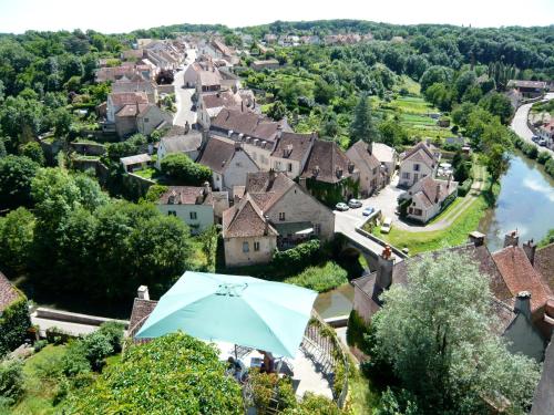 an umbrella in front of a village at La Maison Févret in Semur-en-Auxois