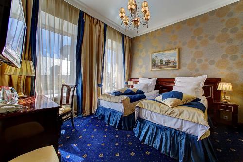 Кровать или кровати в номере Бутик-отель Золотой Треугольник