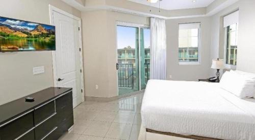 Ένα ή περισσότερα κρεβάτια σε δωμάτιο στο Bali Bay Resort