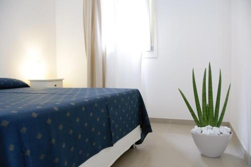 Postel nebo postele na pokoji v ubytování Eco Apartments Cervia