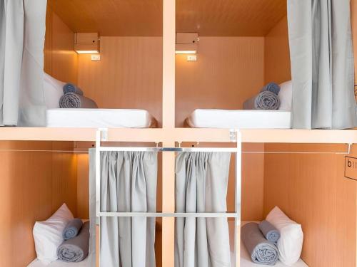 Ένα ή περισσότερα κρεβάτια σε δωμάτιο στο Mini Boxtel Aonang Hostel