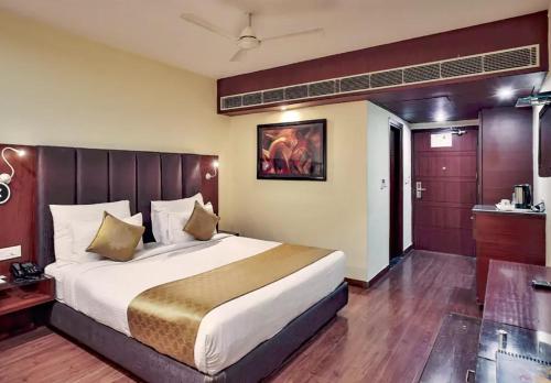 Postel nebo postele na pokoji v ubytování The Kdm