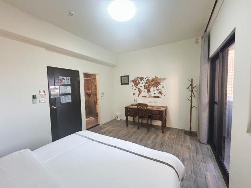 Postel nebo postele na pokoji v ubytování 瑪麗殿民宿