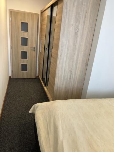 Ένα ή περισσότερα κρεβάτια σε δωμάτιο στο Apartmán Most