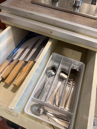 a drawer filled with utensils in a kitchen drawer at Departamento Nuevo Céntrico Las Marías 1 in Saltillo