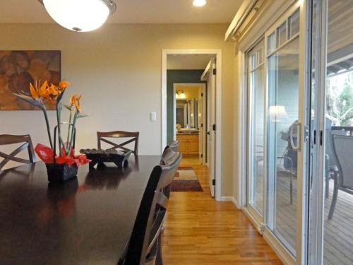 a dining room with a long table and a dining room at Private Vacation Villa Kohola in Motobu