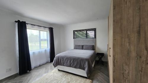 Ένα ή περισσότερα κρεβάτια σε δωμάτιο στο Modern Farmhouse, Pool, WiFi in Estate