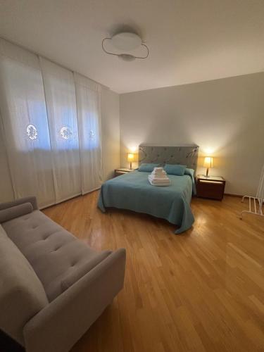 a bedroom with a bed and a couch at Mater Domini in Chieti