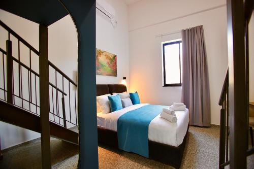 Postel nebo postele na pokoji v ubytování Azura Boutique Hotel