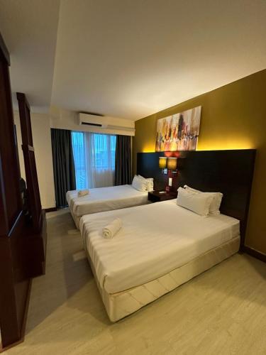 Postel nebo postele na pokoji v ubytování Am suites