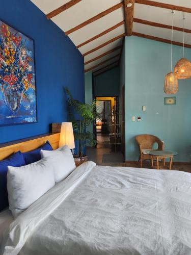 En eller flere senge i et værelse på JEJU Doldam B&B