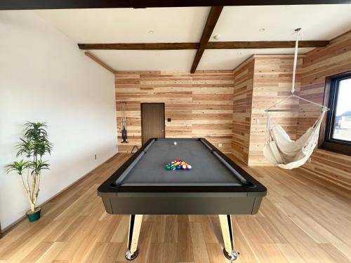 Biliár nebo kulečník v ubytování KONAYUKI Apartment Myoko